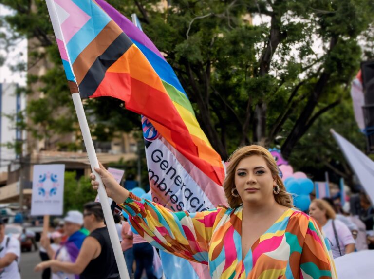 An LGBTQ+ activists waving a pride flag