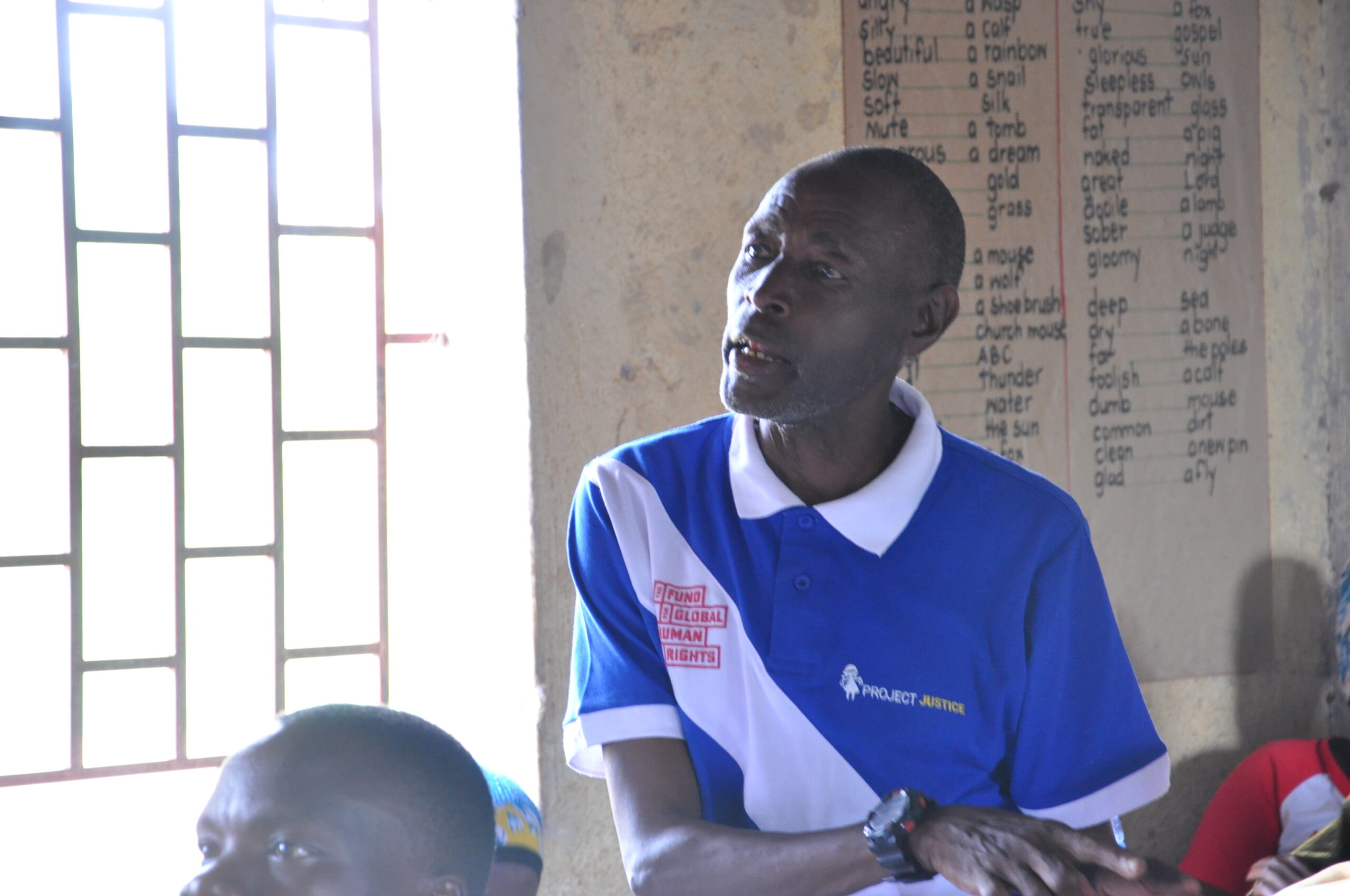 John Sebbowa of Bunyoro Village, Luwero shares his experience with other volunteers on mobilizing communities to support their activities.